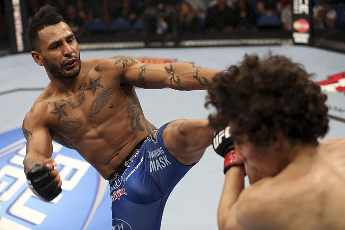 CALGARY, CANADA - JULY 21: (L-R) Francisco Rivera lands a kick to the head of Roland Delorme during their bantamweight bout at UFC 149 inside the Scotiabank Saddledome on July 21, 2012 in Calgary, Alberta, Canada.  (Photo by Nick Laham/Zuffa LLC/Zuffa LLC via Getty Images)