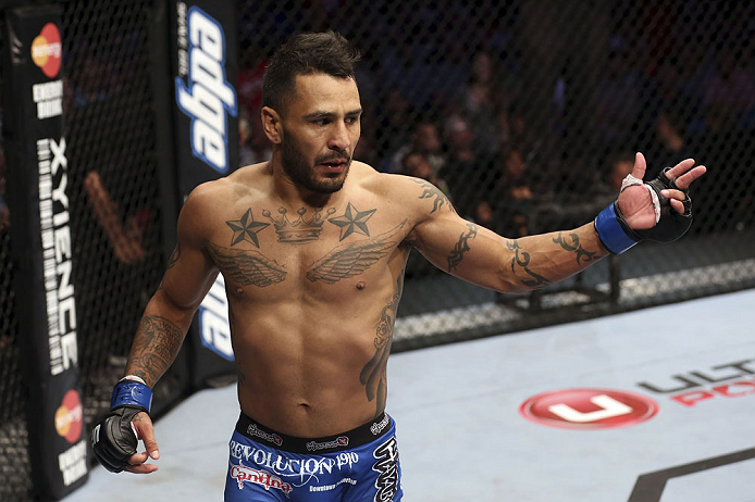 CALGARY, CANADA - JULY 21: Francisco Rivera celebrates after defeating Roland Delorme during their bantamweight bout at UFC 149 inside the Scotiabank Saddledome on July 21, 2012 in Calgary, Alberta, Canada.  (Photo by Nick Laham/Zuffa LLC/Zuffa LLC via Getty Images)