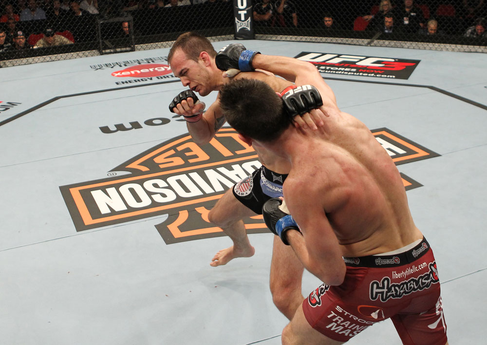 SYDNEY, AUSTRALIA - MARCH 03: (R-L) Steven Siler punches Cole Miller in a featherweight bout during the UFC on FX event at Allphones Arena on March 3, 2012 in Sydney, Australia. (Photo by Josh Hedges/Zuffa LLC/Zuffa LLC via Getty Images) *** Local Caption *** Cole Miller; Steven Siler