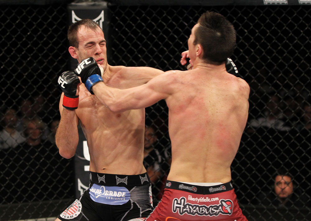 SYDNEY, AUSTRALIA - MARCH 03: (R-L) Steven Siler and Cole Miller trade punches in a featherweight bout during the UFC on FX event at Allphones Arena on March 3, 2012 in Sydney, Australia. (Photo by Josh Hedges/Zuffa LLC/Zuffa LLC via Getty Images) *** Local Caption *** Cole Miller; Steven Siler