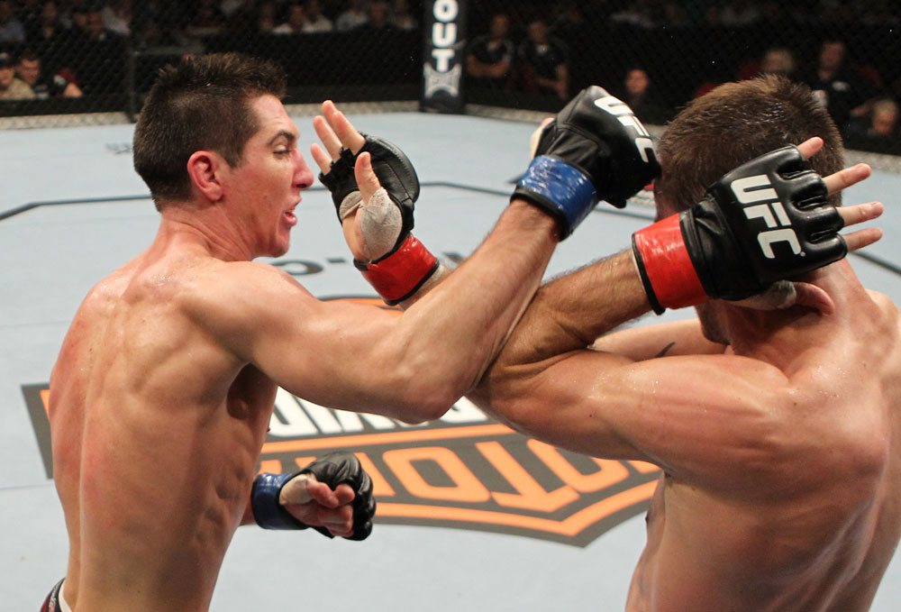 SYDNEY, AUSTRALIA - MARCH 03: (L-R) Steven Siler punches Cole Miller in a featherweight bout during the UFC on FX event at Allphones Arena on March 3, 2012 in Sydney, Australia. (Photo by Josh Hedges/Zuffa LLC/Zuffa LLC via Getty Images) *** Local Caption *** Cole Miller; Steven Siler
