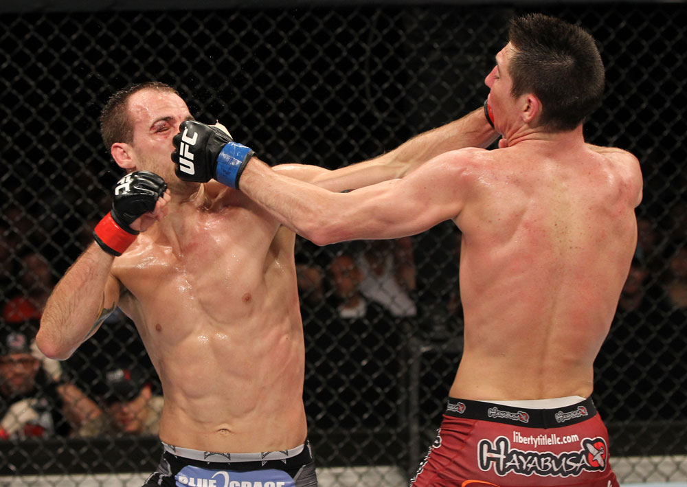SYDNEY, AUSTRALIA - MARCH 03: (R-L) Steven Siler and Cole Miller trade punches in a featherweight bout during the UFC on FX event at Allphones Arena on March 3, 2012 in Sydney, Australia. (Photo by Josh Hedges/Zuffa LLC/Zuffa LLC via Getty Images) *** Local Caption *** Cole Miller; Steven Siler