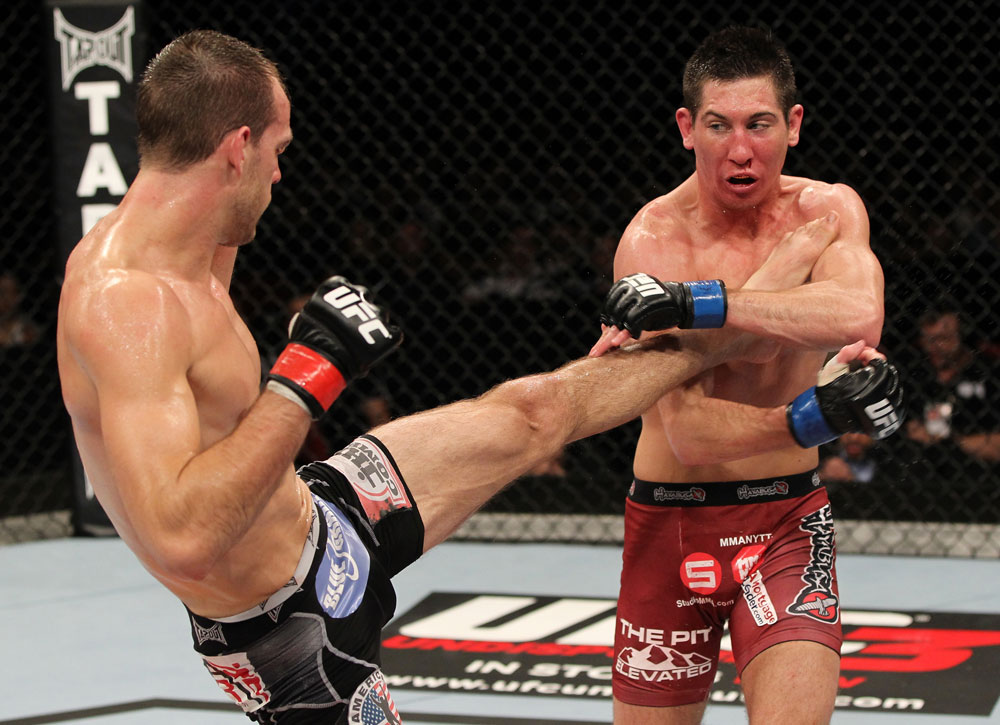 SYDNEY, AUSTRALIA - MARCH 03: (L-R) Cole Miller kicks Steven Siler in a featherweight bout during the UFC on FX event at Allphones Arena on March 3, 2012 in Sydney, Australia. (Photo by Josh Hedges/Zuffa LLC/Zuffa LLC via Getty Images) *** Local Caption *** Cole Miller; Steven Siler