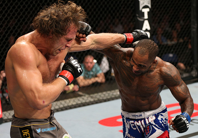 NOTTINGHAM, ENGLAND - SEPTEMBER 29: (R-L) Jimi Manuwa punches Kyle Kingsbury during their light heavyweight fight at the UFC on Fuel TV event at Capital FM Arena on September 29, 2012 in Nottingham, England. (Photo by Josh Hedges/Zuffa LLC/Zuffa LLC via Getty Images)