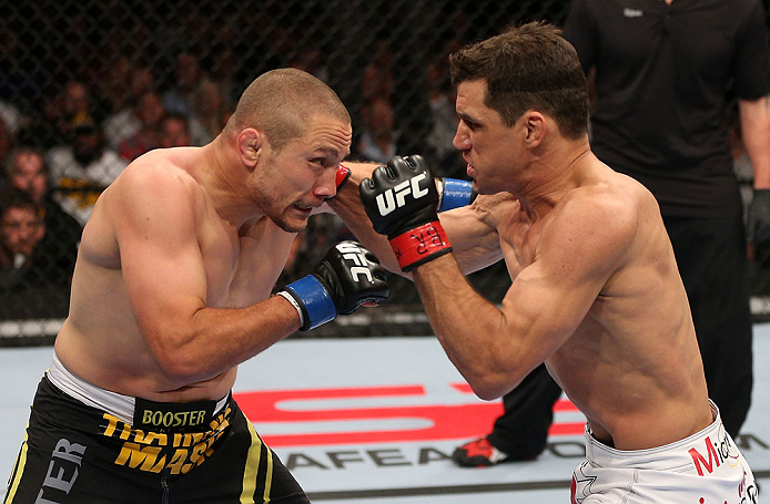 MINNEAPOLIS, MN - OCTOBER 05:  (R-L) Aaron Simpson punches Mike Pierce during their welterweight fight at the UFC on FX event at Target Center on October 5, 2012 in Minneapolis, Minnesota.  (Photo by Josh Hedges/Zuffa LLC/Zuffa LLC via Getty Images)