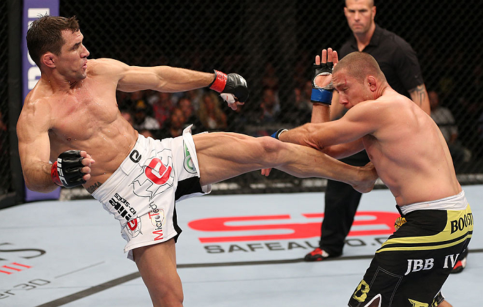 MINNEAPOLIS, MN - OCTOBER 05: (L-R) Aaron Simpson kicks Mike Pierce during their welterweight fight at the UFC on FX event at Target Center on October 5, 2012 in Minneapolis, Minnesota. (Photo by Josh Hedges/Zuffa LLC/Zuffa LLC via Getty Images)