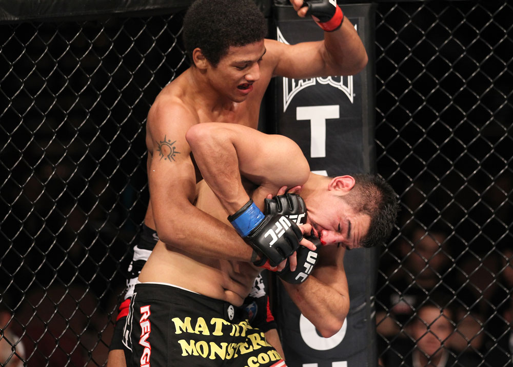 LAS VEGAS, NV - FEBRUARY 04:  Alex Caceres (top) delivers punches to Edwin Figueora during the UFC 143 event at Mandalay Bay Events Center on February 4, 2012 in Las Vegas, Nevada.  (Photo by Nick Laham/Zuffa LLC/Zuffa LLC via Getty Images) *** Local Caption *** Alex Caceres; Edwin Figueroa