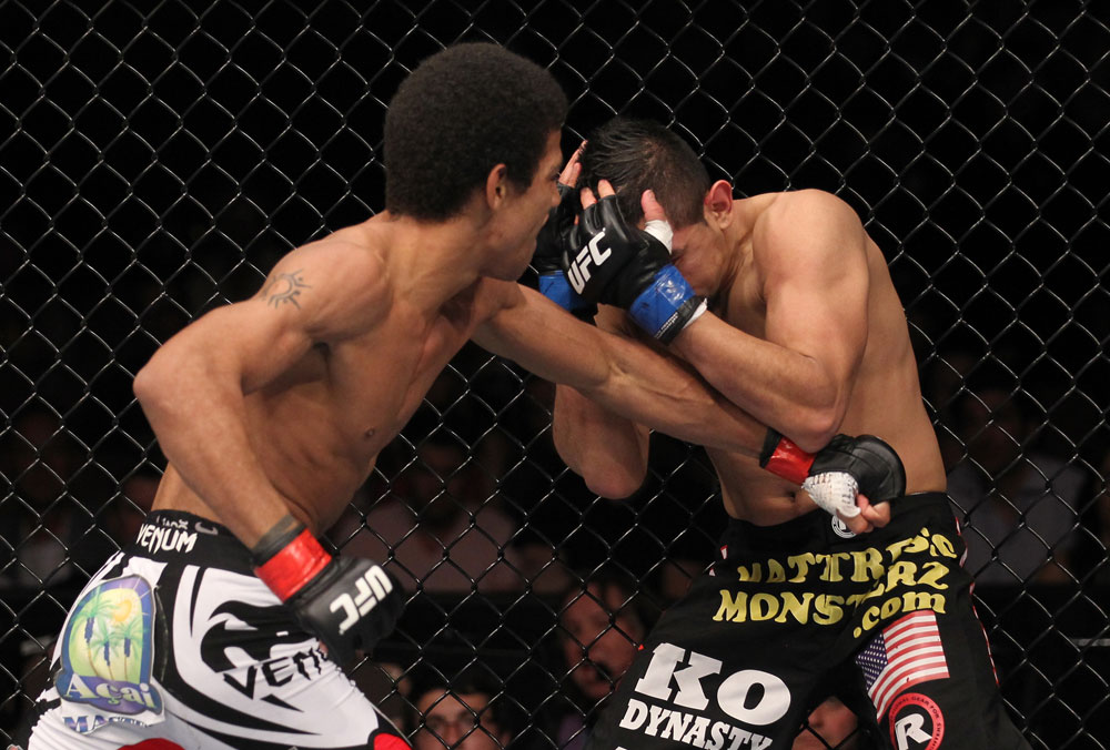 LAS VEGAS, NV - FEBRUARY 04:  Alex Caceres (left) punches Edwin Figueroa during the UFC 143 event at Mandalay Bay Events Center on February 4, 2012 in Las Vegas, Nevada.  (Photo by Nick Laham/Zuffa LLC/Zuffa LLC via Getty Images) *** Local Caption *** Alex Caceres; Edwin Figueroa