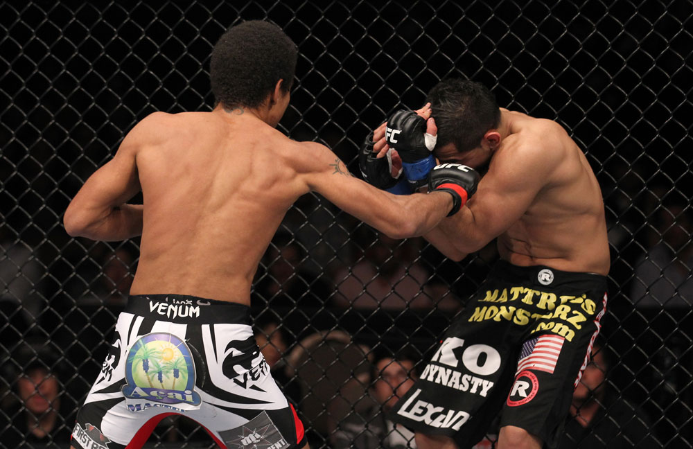 LAS VEGAS, NV - FEBRUARY 04:  Alex Caceres (left) punches Edwin Figueroa during the UFC 143 event at Mandalay Bay Events Center on February 4, 2012 in Las Vegas, Nevada.  (Photo by Nick Laham/Zuffa LLC/Zuffa LLC via Getty Images) *** Local Caption *** Alex Caceres; Edwin Figueroa