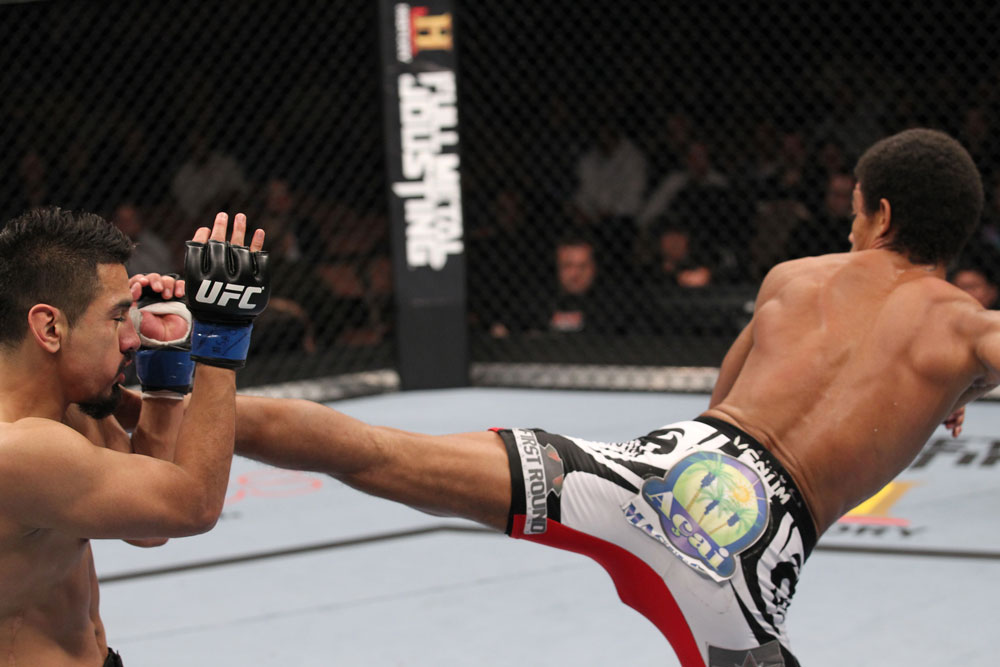 LAS VEGAS, NV - FEBRUARY 04:  Alex Caceres (right) kicks Edwin Figueroa during the UFC 143 event at Mandalay Bay Events Center on February 4, 2012 in Las Vegas, Nevada.  (Photo by Nick Laham/Zuffa LLC/Zuffa LLC via Getty Images) *** Local Caption *** Alex Caceres; Edwin Figueroa