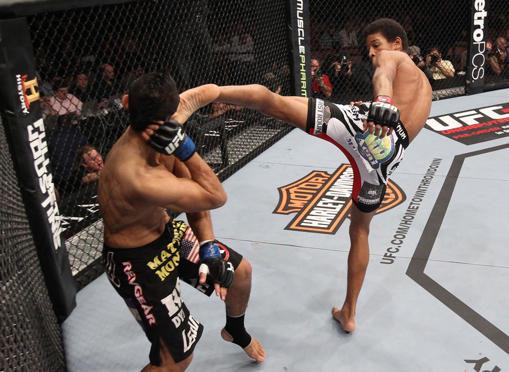 LAS VEGAS, NV - FEBRUARY 04:  Alex Caceres (right) kicks Edwin Figueroa during the UFC 143 event at Mandalay Bay Events Center on February 4, 2012 in Las Vegas, Nevada.  (Photo by Nick Laham/Zuffa LLC/Zuffa LLC via Getty Images) *** Local Caption *** Alex Caceres; Edwin Figueroa