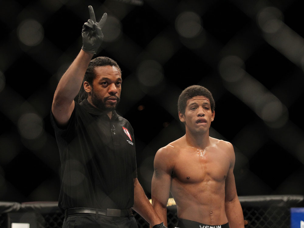 LAS VEGAS, NV - FEBRUARY 04:  Referee Herb Dean (left) deducts two points from Alex Caceres after a series of low blows in his fight against Edwin Figueroa during the UFC 143 event at Mandalay Bay Events Center on February 4, 2012 in Las Vegas, Nevada.  (Photo by Josh Hedges/Zuffa LLC/Zuffa LLC via Getty Images) *** Local Caption *** Herb Dean; Alex Caceres