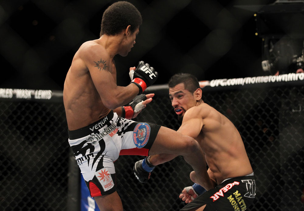 LAS VEGAS, NV - FEBRUARY 04:  Alex Caceres (left) kicks Edwin Figueroa during the UFC 143 event at Mandalay Bay Events Center on February 4, 2012 in Las Vegas, Nevada.  (Photo by Josh Hedges/Zuffa LLC/Zuffa LLC via Getty Images) *** Local Caption *** Alex Caceres; Edwin Figueroa