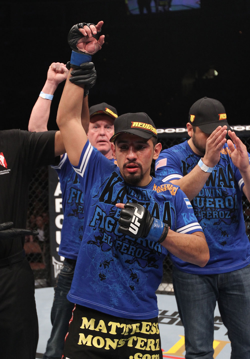 LAS VEGAS, NV - FEBRUARY 04:  Edwin Figueroa is declared the winner in his fight against Alex Caceres during the UFC 143 event at Mandalay Bay Events Center on February 4, 2012 in Las Vegas, Nevada.  (Photo by Nick Laham/Zuffa LLC/Zuffa LLC via Getty Images) *** Local Caption *** Edwin Figueroa