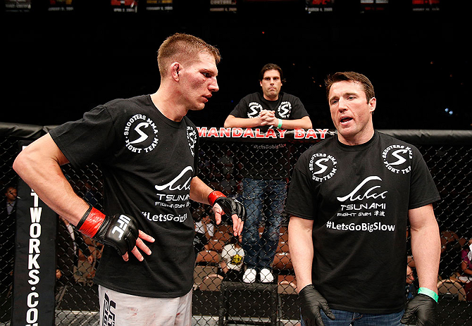 LAS VEGAS, NV - APRIL 13:   (L-R) Collin Hart speaks with Chael Sonnen after his middleweight fight at the Mandalay Bay Events Center  on April 13, 2013 in Las Vegas, Nevada.  (Photo by Josh Hedges/Zuffa LLC/Zuffa LLC via Getty Images)  *** Local Caption *** Luke Barnatt; Collin Hart