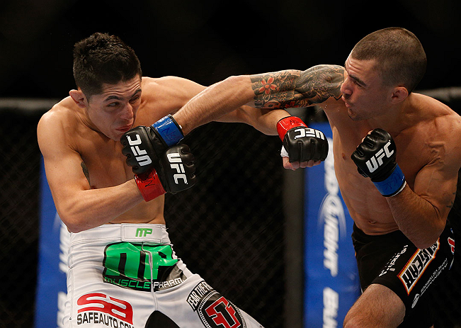 LAS VEGAS, NV - DECEMBER 29:  Byron Bloodworth (right) punches Erik Perez during their bantamweight fight at UFC 155 on December 29, 2012 at MGM Grand Garden Arena in Las Vegas, Nevada. (Photo by Josh Hedges/Zuffa LLC/Zuffa LLC via Getty Images) *** Local Caption *** Erik Perez; Byron Bloodworth