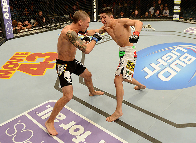 LAS VEGAS, NV - DECEMBER 29:  Erik Perez (right) punches Byron Bloodworth during their bantamweight fight at UFC 155 on December 29, 2012 at MGM Grand Garden Arena in Las Vegas, Nevada. (Photo by Donald Miralle/Zuffa LLC/Zuffa LLC via Getty Images) *** Local Caption *** Erik Perez; Byron Bloodworth