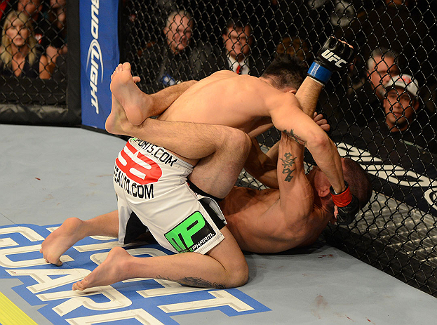LAS VEGAS, NV - DECEMBER 29:  Erik Perez (top) punches Byron Bloodworth during their bantamweight fight at UFC 155 on December 29, 2012 at MGM Grand Garden Arena in Las Vegas, Nevada. (Photo by Donald Miralle/Zuffa LLC/Zuffa LLC via Getty Images) *** Local Caption *** Erik Perez; Byron Bloodworth