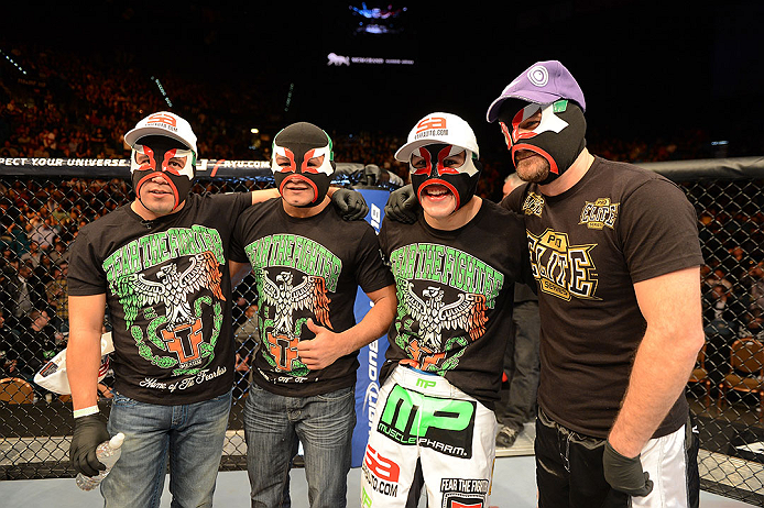LAS VEGAS, NV - DECEMBER 29:  Erik Perez (second from right) and teammates wearing lucha libre masks at UFC 155 on December 29, 2012 at MGM Grand Garden Arena in Las Vegas, Nevada. (Photo by Donald Miralle/Zuffa LLC/Zuffa LLC via Getty Images) *** Local Caption *** Erik Perez; Byron Bloodworth