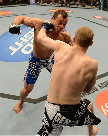 LAS VEGAS, NV - FEBRUARY 02: Evan Dunham (black trunks) punches Gleison Tibau during their lightweight fight at UFC 156 on February 2, 2013 at the Mandalay Bay Events Center in Las Vegas, Nevada. (Photo by Donald Miralle/Zuffa LLC/Zuffa LLC via Getty Images) *** Local Caption *** Gleison Tibau; Evan Dunham