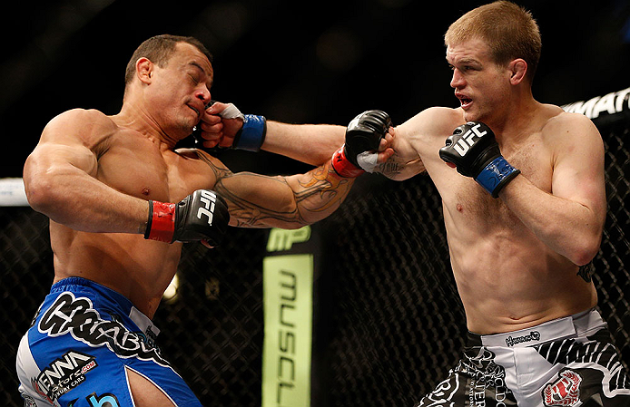 LAS VEGAS, NV - FEBRUARY 02: (R-L) Evan Dunham punches Gleison Tibau during their lightweight fight at UFC 156 on February 2, 2013 at the Mandalay Bay Events Center in Las Vegas, Nevada. (Photo by Josh Hedges/Zuffa LLC/Zuffa LLC via Getty Images) *** Local Caption *** Gleison Tibau; Evan Dunham