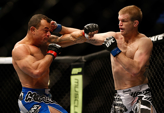 LAS VEGAS, NV - FEBRUARY 02: (R-L) Evan Dunham punches Gleison Tibau during their lightweight fight at UFC 156 on February 2, 2013 at the Mandalay Bay Events Center in Las Vegas, Nevada. (Photo by Josh Hedges/Zuffa LLC/Zuffa LLC via Getty Images) *** Local Caption *** Gleison Tibau; Evan Dunham