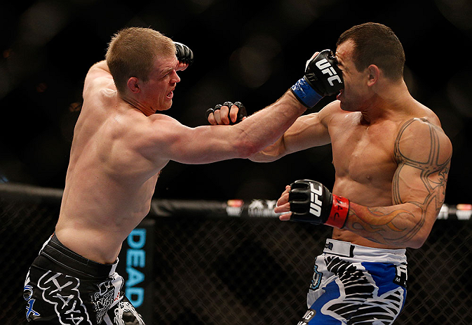 LAS VEGAS, NV - FEBRUARY 02: (L-R) Evan Dunham punches Gleison Tibau during their lightweight fight at UFC 156 on February 2, 2013 at the Mandalay Bay Events Center in Las Vegas, Nevada. (Photo by Josh Hedges/Zuffa LLC/Zuffa LLC via Getty Images) *** Local Caption *** Gleison Tibau; Evan Dunham