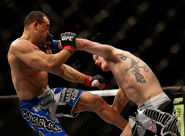 LAS VEGAS, NV - FEBRUARY 02: (R-L) Evan Dunham punches Gleison Tibau during their lightweight fight at UFC 156 on February 2, 2013 at the Mandalay Bay Events Center in Las Vegas, Nevada. (Photo by Josh Hedges/Zuffa LLC/Zuffa LLC via Getty Images) *** Local Caption *** Gleison Tibau; Evan Dunham