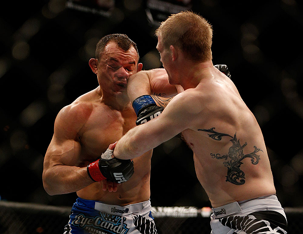 LAS VEGAS, NV - FEBRUARY 02: (R-L) Evan Dunham elbows Gleison Tibau during their lightweight fight at UFC 156 on February 2, 2013 at the Mandalay Bay Events Center in Las Vegas, Nevada. (Photo by Josh Hedges/Zuffa LLC/Zuffa LLC via Getty Images) *** Local Caption *** Gleison Tibau; Evan Dunham