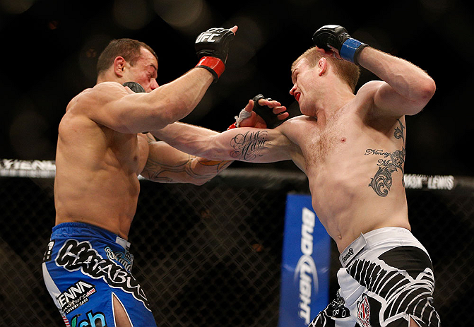 LAS VEGAS, NV - FEBRUARY 02: (R-L) Evan Dunham punches Gleison Tibau during their lightweight fight at UFC 156 on February 2, 2013 at the Mandalay Bay Events Center in Las Vegas, Nevada. (Photo by Josh Hedges/Zuffa LLC/Zuffa LLC via Getty Images) *** Local Caption *** Gleison Tibau; Evan Dunham
