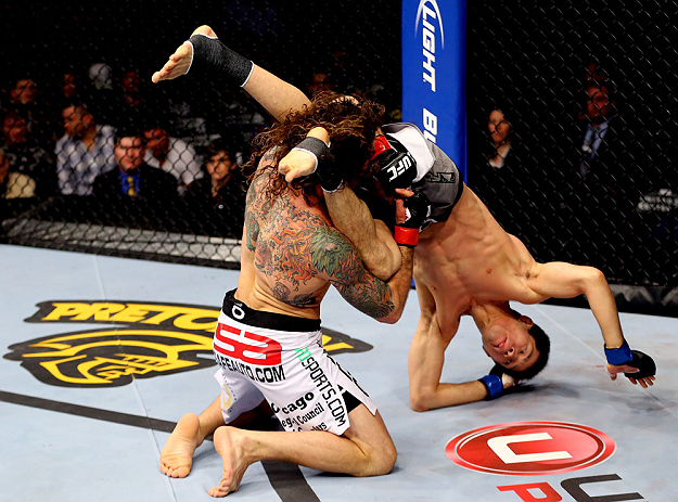 CHICAGO, IL - JANUARY 26:  Clay Guida (L) dumps Hatsu Hioki (R) during their Featherweight Bout part of UFC on FOX at United Center on January 26, 2013 in Chicago, Illinois.  (Photo by Al Bello/Zuffa LLC/Zuffa LLC Via Getty Images)
