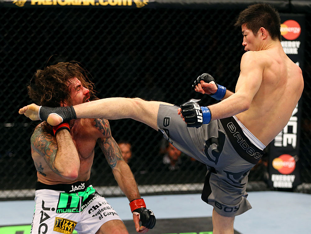 CHICAGO, IL - JANUARY 26:  Hatsu Hioki (R) kicks Clay Guida (L) during their Featherweight Bout part of UFC on FOX at United Center on January 26, 2013 in Chicago, Illinois.  (Photo by Al Bello/Zuffa LLC/Zuffa LLC Via Getty Images)