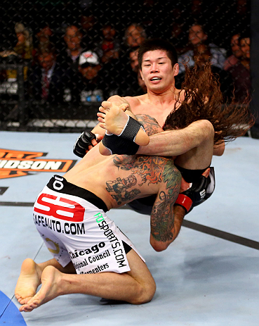 CHICAGO, IL - JANUARY 26:  Clay Guida (L) dumps Hatsu Hioki (R) during their Featherweight Bout part of UFC on FOX at United Center on January 26, 2013 in Chicago, Illinois.  (Photo by Al Bello/Zuffa LLC/Zuffa LLC Via Getty Images)