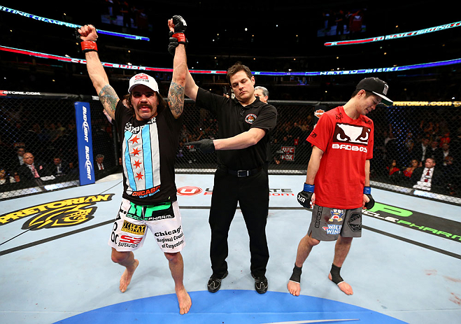 CHICAGO, IL - JANUARY 26:  Clay Guida (L) celebrates defeating Hatsu Hioki (R) during their Featherweight Bout part of UFC on FOX at United Center on January 26, 2013 in Chicago, Illinois.  (Photo by Al Bello/Zuffa LLC/Zuffa LLC Via Getty Images)