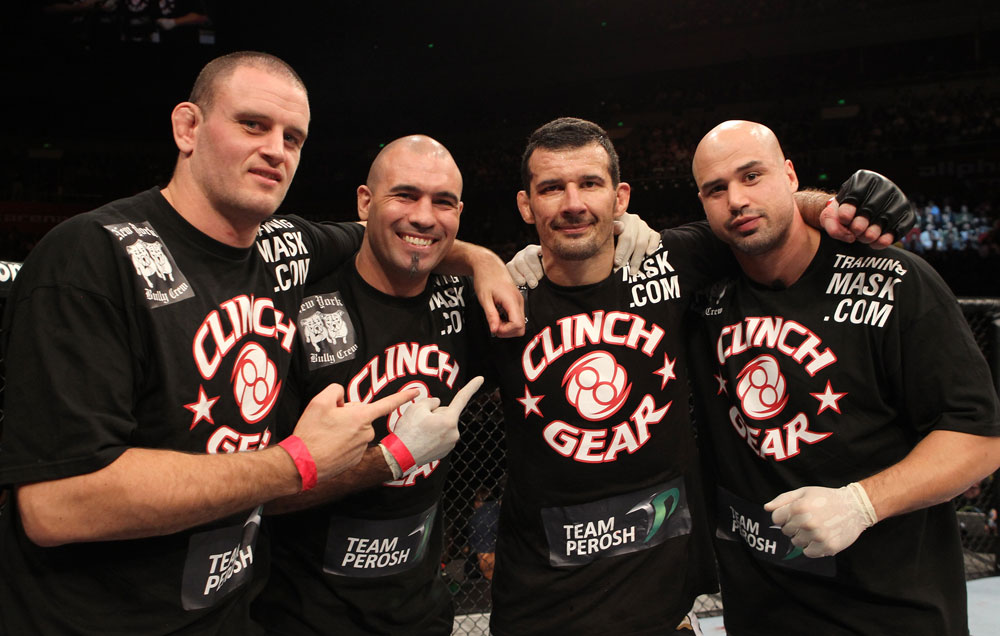 SYDNEY, AUSTRALIA - MARCH 03: Anthony Perosh (second from right) poses for a photo with his trainers after defeating Nick Penner in a light heavyweight bout during the UFC on FX event at Allphones Arena on March 3, 2012 in Sydney, Australia. (Photo by Josh Hedges/Zuffa LLC/Zuffa LLC via Getty Images) *** Local Caption *** Anthony Perosh; Elvis Sinosic