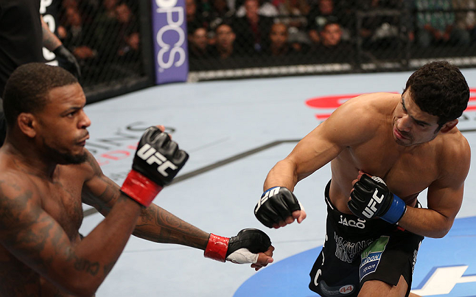 MINNEAPOLIS, MN - OCTOBER 05: (R-L) Danny Castillo knocks down Michael Johnson with a punch during their lightweight fight at the UFC on FX event at Target Center on October 5, 2012 in Minneapolis, Minnesota. (Photo by Josh Hedges/Zuffa LLC/Zuffa LLC via Getty Images)