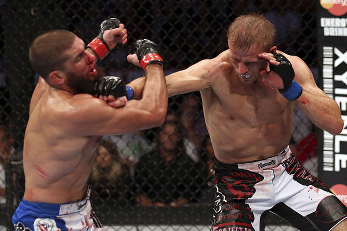 CALGARY, CANADA - JULY 21: (R-L) Nick Ring lands a punch to the head of Court McGee during their middleweight bout at UFC 149 inside the Scotiabank Saddledome on July 21, 2012 in Calgary, Alberta, Canada.  (Photo by Nick Laham/Zuffa LLC/Zuffa LLC via Getty Images)