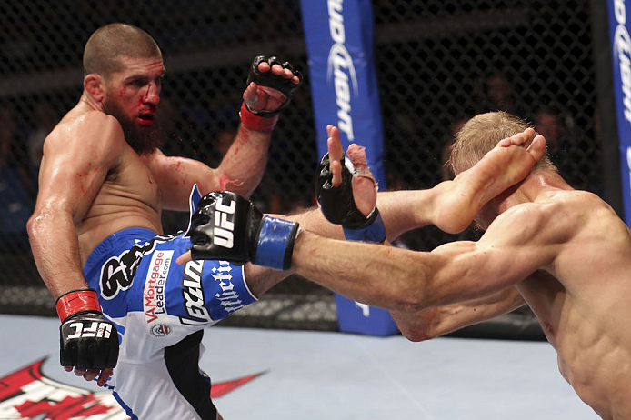 CALGARY, CANADA - JULY 21:  Court McGee lands a kick to the head of Nick Ring during their middleweight bout at UFC 149 inside the Scotiabank Saddledome on July 21, 2012 in Calgary, Alberta, Canada.  (Photo by Nick Laham/Zuffa LLC/Zuffa LLC via Getty Images)