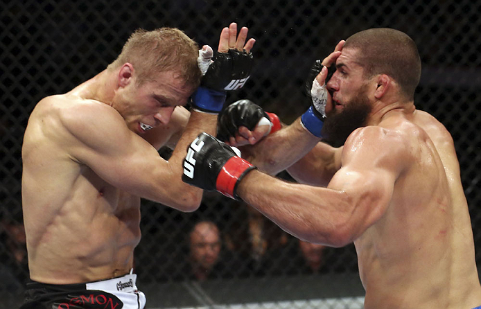 CALGARY, CANADA - JULY 21:  (L-R) Nick Ring exchanges strikes with Court McGee during their middleweight bout at UFC 149 inside the Scotiabank Saddledome on July 21, 2012 in Calgary, Alberta, Canada.  (Photo by Nick Laham/Zuffa LLC/Zuffa LLC via Getty Images)