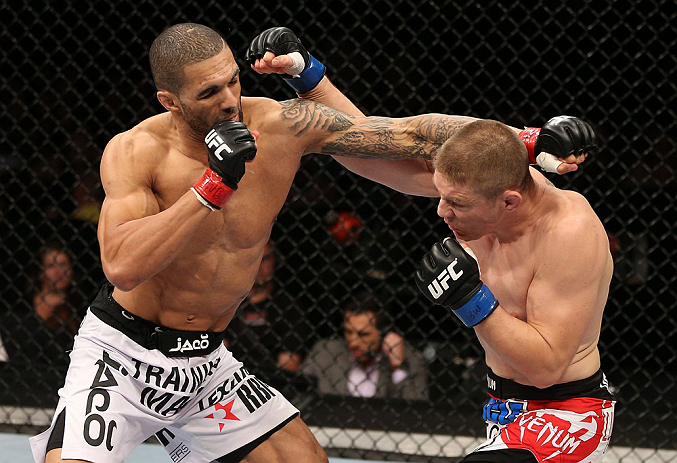 NOTTINGHAM, ENGLAND - SEPTEMBER 29: (L-R) Che Mills and Duane Ludwig trade punches during their welterweight fight at the UFC on Fuel TV event at Capital FM Arena on September 29, 2012 in Nottingham, England. (Photo by Josh Hedges/Zuffa LLC/Zuffa LLC via Getty Images)
