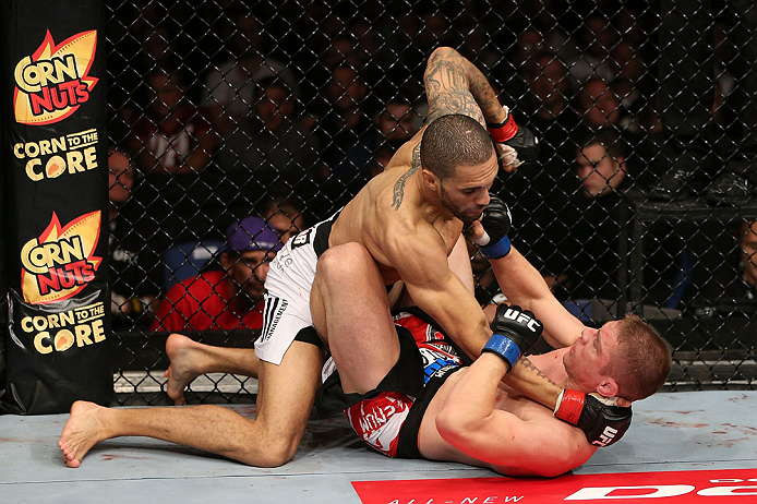 NOTTINGHAM, ENGLAND - SEPTEMBER 29: (L-R) Che Mills punches Duane Ludwig during their welterweight fight at the UFC on Fuel TV event at Capital FM Arena on September 29, 2012 in Nottingham, England. (Photo by Josh Hedges/Zuffa LLC/Zuffa LLC via Getty Images)