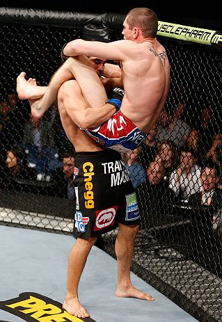 LONDON, ENGLAND - FEBRUARY 16: (R-L) Paul Sass attempts a triangle choke against Danny Castillo in their lightweight fight during the UFC on Fuel TV event on February 16, 2013 at Wembley Arena in London, England. (Photo by Josh Hedges/Zuffa LLC/Zuffa LLC via Getty Images)