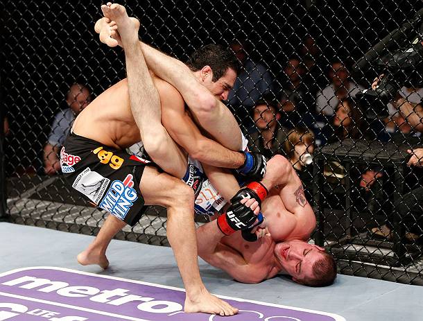 LONDON, ENGLAND - FEBRUARY 16: (R-L) Paul Sass attempts an arm bar submission against Danny Castillo in their lightweight fight during the UFC on Fuel TV event on February 16, 2013 at Wembley Arena in London, England. (Photo by Josh Hedges/Zuffa LLC/Zuffa LLC via Getty Images)