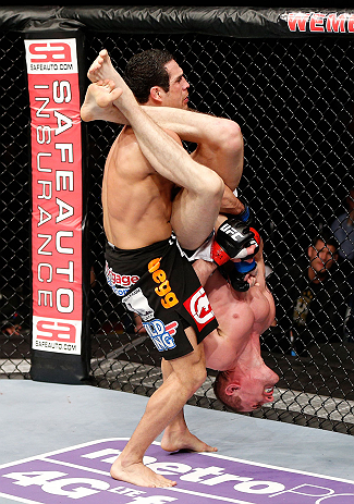 LONDON, ENGLAND - FEBRUARY 16: (R-L) Paul Sass attempts an arm bar submission against Danny Castillo in their lightweight fight during the UFC on Fuel TV event on February 16, 2013 at Wembley Arena in London, England. (Photo by Josh Hedges/Zuffa LLC/Zuffa LLC via Getty Images)