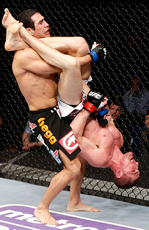 LONDON, ENGLAND - FEBRUARY 16: (R-L) Paul Sass attempts an arm bar submission against Danny Castillo in their lightweight fight during the UFC on Fuel TV event on February 16, 2013 at Wembley Arena in London, England. (Photo by Josh Hedges/Zuffa LLC/Zuffa LLC via Getty Images)