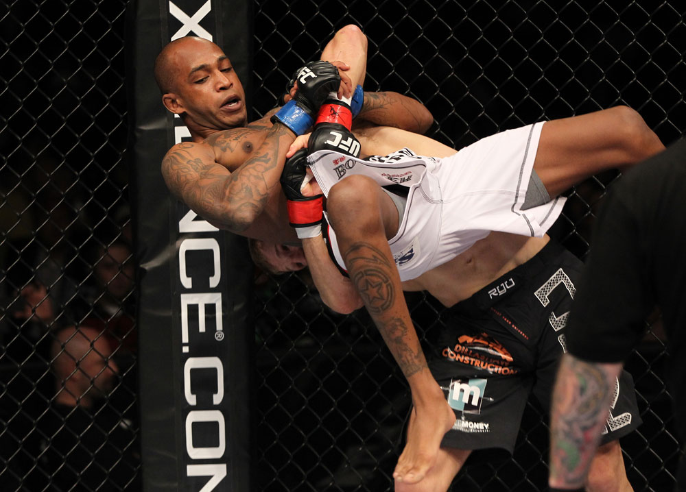 OMAHA, NE - FEBRUARY 15: (R-L) TJ Dillashaw prepares to slam Walel Watson during the UFC on FUEL TV event at Omaha Civic Auditorium on February 15, 2012 in Omaha, Nebraska. (Photo by Josh Hedges/Zuffa LLC/Zuffa LLC via Getty Images) *** Local Caption *** TJ Dillashaw; Walel Watson