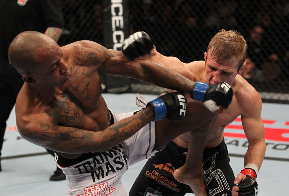 OMAHA, NE - FEBRUARY 15: (R-L) TJ Dillashaw punches Walel Watson during the UFC on FUEL TV event at Omaha Civic Auditorium on February 15, 2012 in Omaha, Nebraska. (Photo by Josh Hedges/Zuffa LLC/Zuffa LLC via Getty Images) *** Local Caption *** TJ Dillashaw; Walel Watson
