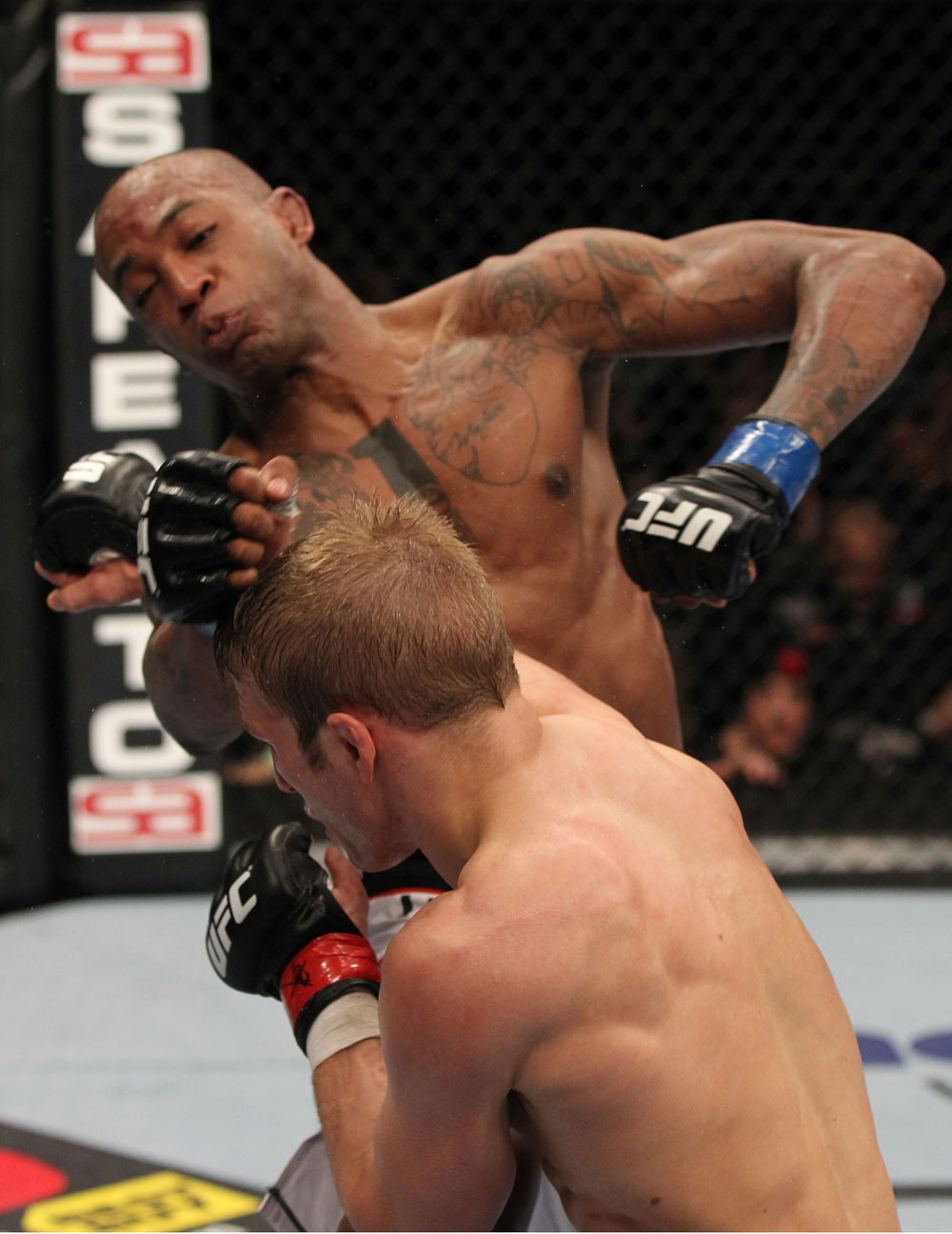 OMAHA, NE - FEBRUARY 15: (R-L) TJ Dillashaw punches Walel Watson during the UFC on FUEL TV event at Omaha Civic Auditorium on February 15, 2012 in Omaha, Nebraska. (Photo by Josh Hedges/Zuffa LLC/Zuffa LLC via Getty Images) *** Local Caption *** TJ Dillashaw; Walel Watson