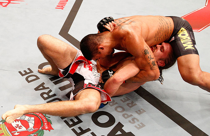 SAO PAULO, BRAZIL - JANUARY 19: Ronny Markes (top) attempts a shoulder lock submission against Andrew Craig in their middleweight fight at the UFC on FX event on January 19, 2013 at Ibirapuera Gymnasium in Sao Paulo, Brazil. (Photo by Josh Hedges/Zuffa LLC/Zuffa LLC via Getty Images)