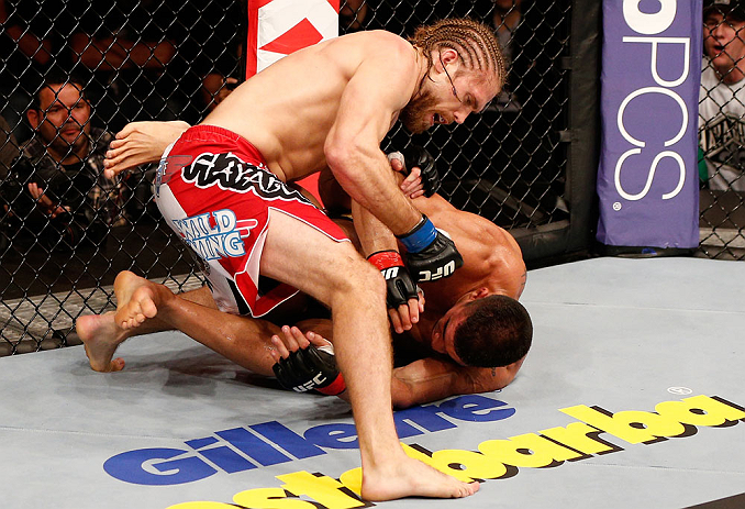 SAO PAULO, BRAZIL - JANUARY 19: (L-R) Andrew Craig punches Ronny Markes in their middleweight fight at the UFC on FX event on January 19, 2013 at Ibirapuera Gymnasium in Sao Paulo, Brazil. (Photo by Josh Hedges/Zuffa LLC/Zuffa LLC via Getty Images)